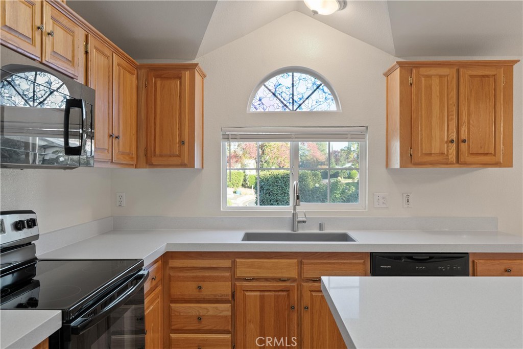 2050 Springfield Drive, Unit 143 Chico, CA 95928 - Photo 13 of 43 a kitchen with a stove a sink and a window