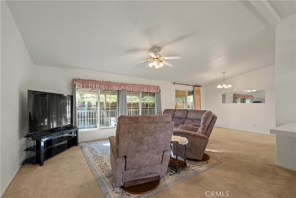 2050 Springfield Drive, Unit 143 Chico, CA 95928 - Photo 2 of 43 a living room with furniture and a flat screen tv