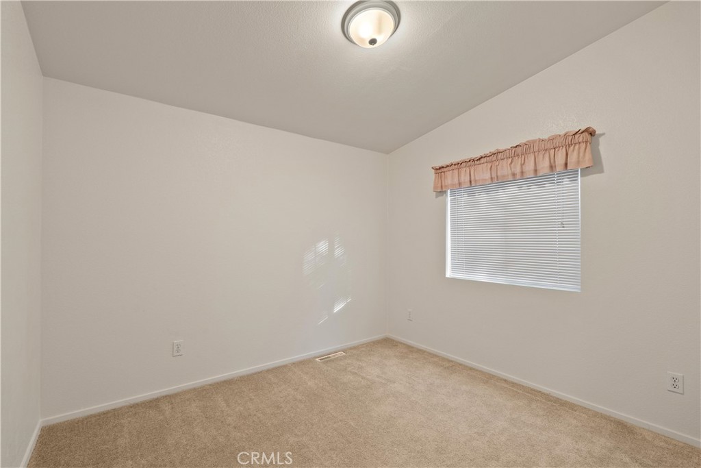 2050 Springfield Drive, Unit 143 Chico, CA 95928 - Photo 22 of 43 an empty room with a window