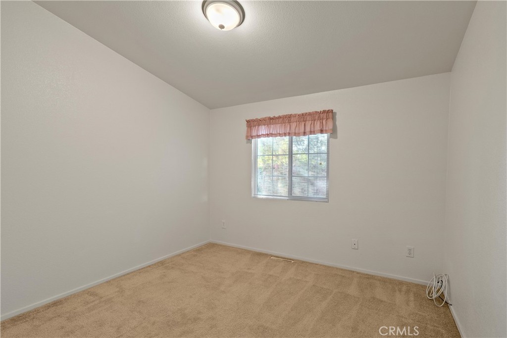 2050 Springfield Drive, Unit 143 Chico, CA 95928 - Photo 24 of 43 an empty room with a window