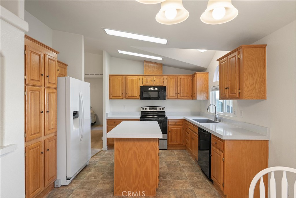 2050 Springfield Drive, Unit 143 Chico, CA 95928 - Photo 3 of 43 a kitchen with stainless steel appliances granite countertop a sink stove and refrigerator