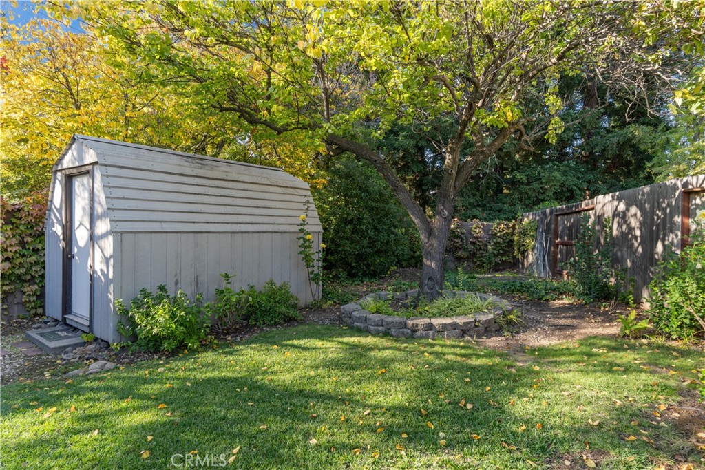 2050 Springfield Drive, Unit 143 Chico, CA 95928 - Photo 31 of 43 a view of a backyard with plants and large trees