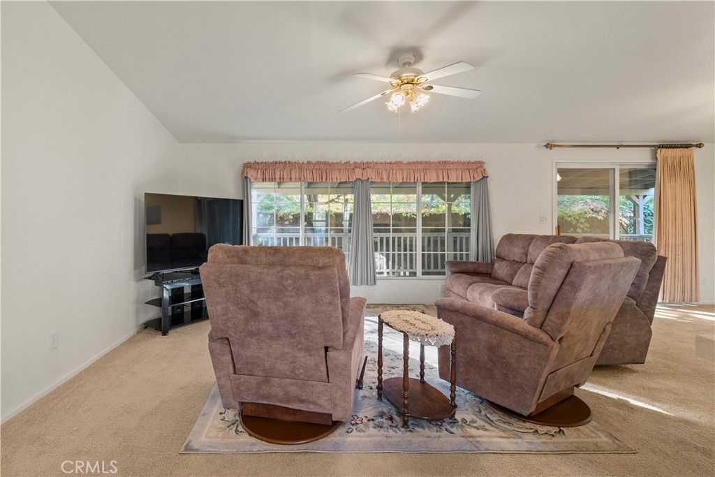 2050 Springfield Drive, Unit 143 Chico, CA 95928 - Photo 6 of 43 a living room with furniture and a flat screen tv