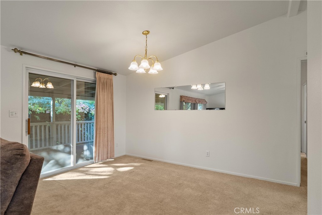 2050 Springfield Drive, Unit 143 Chico, CA 95928 - Photo 9 of 43 a view of a livingroom with a chandelier fan and windows