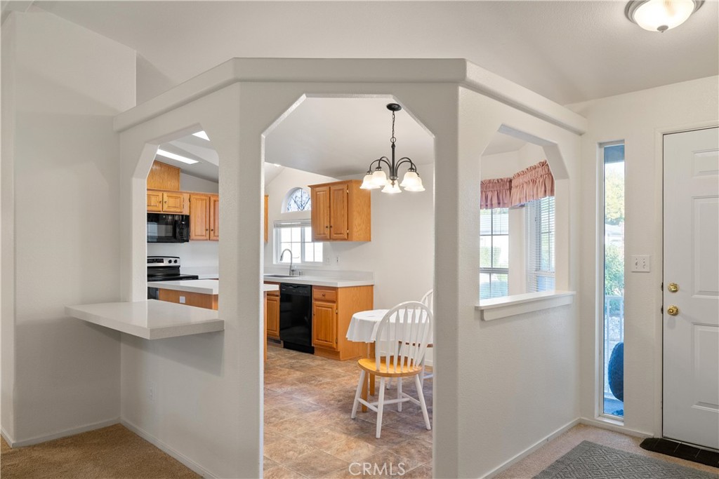 2050 Springfield Drive, Unit 143 Chico, CA 95928 - Photo 10 of 43 a living room with furniture and a fireplace
