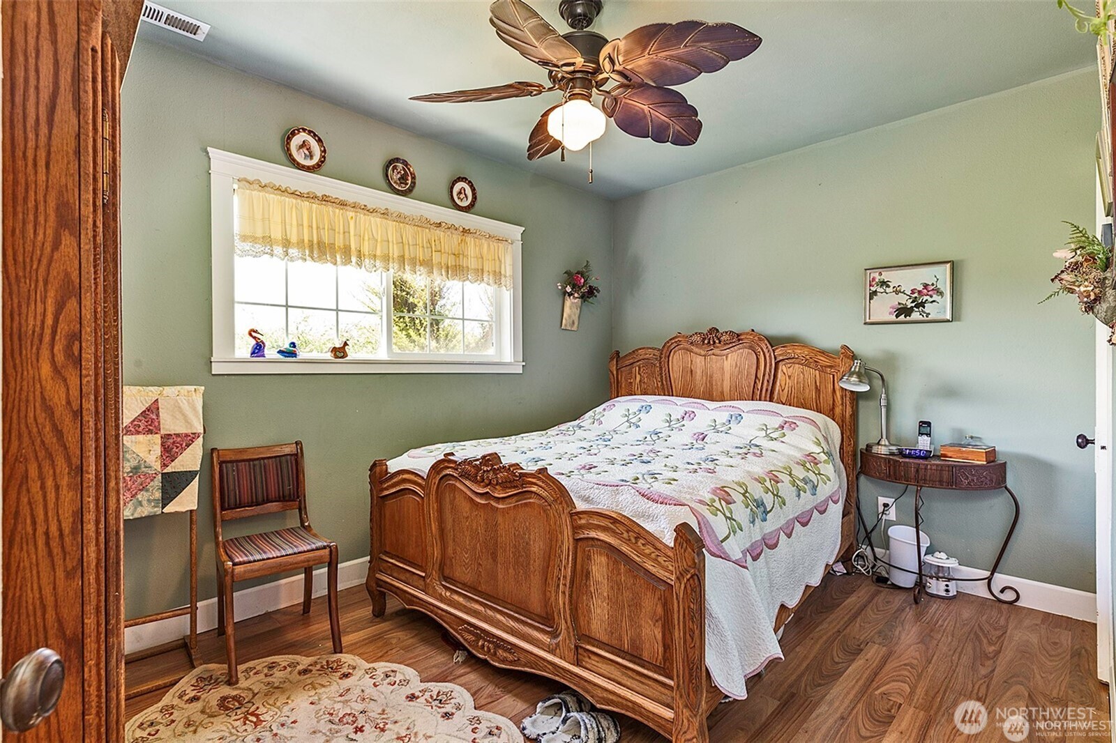 379 Twin Oaks Road Chehalis, WA 98532 - Photo 11 of 30 a bedroom with a bed and a chandelier