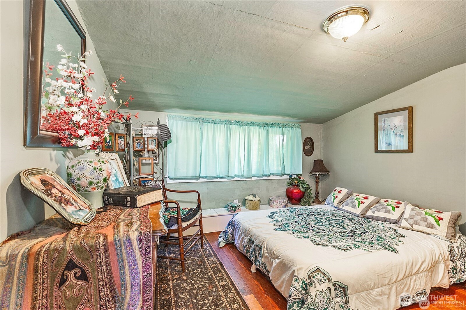 379 Twin Oaks Road Chehalis, WA 98532 - Photo 13 of 30 a bed sitting in a bedroom next to a window