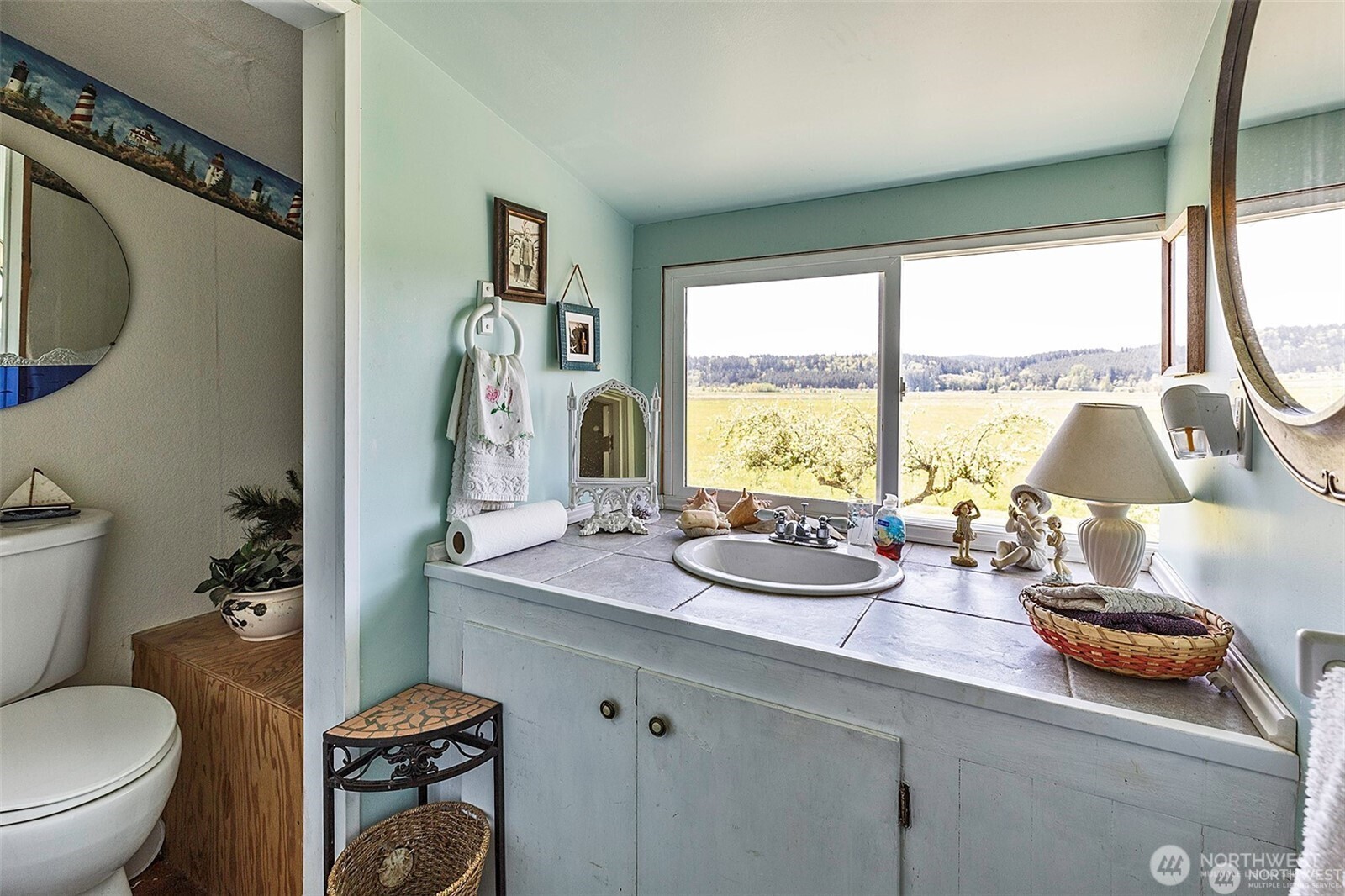 379 Twin Oaks Road Chehalis, WA 98532 - Photo 15 of 30 a bathroom with a granite countertop sink toilet and a large mirror