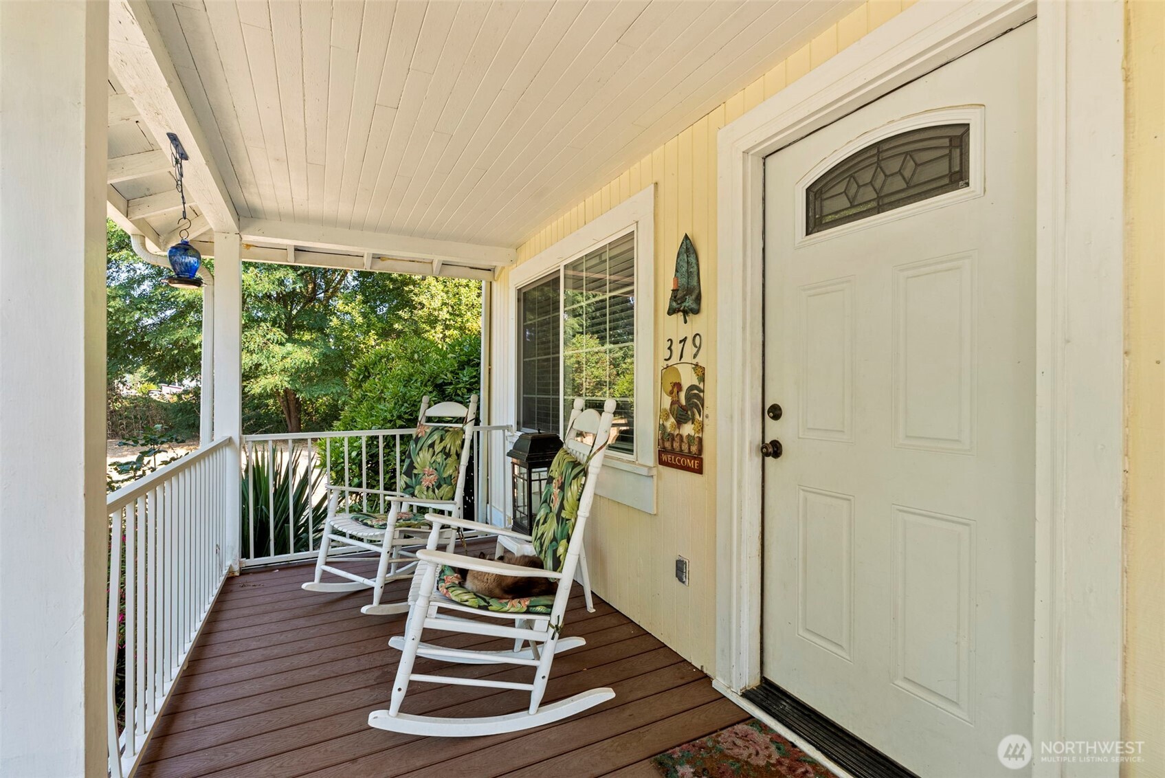 379 Twin Oaks Road Chehalis, WA 98532 - Photo 4 of 30 a view of a balcony with wooden floor and outdoor seating