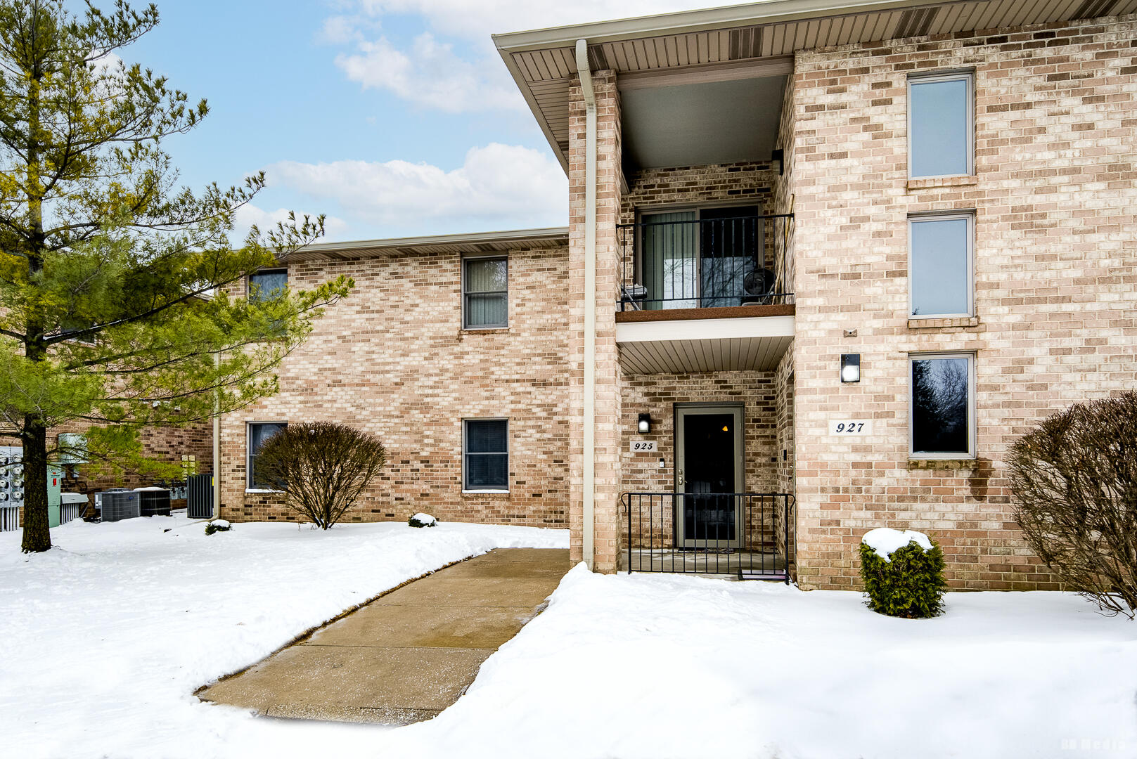 a front view of a house with yard