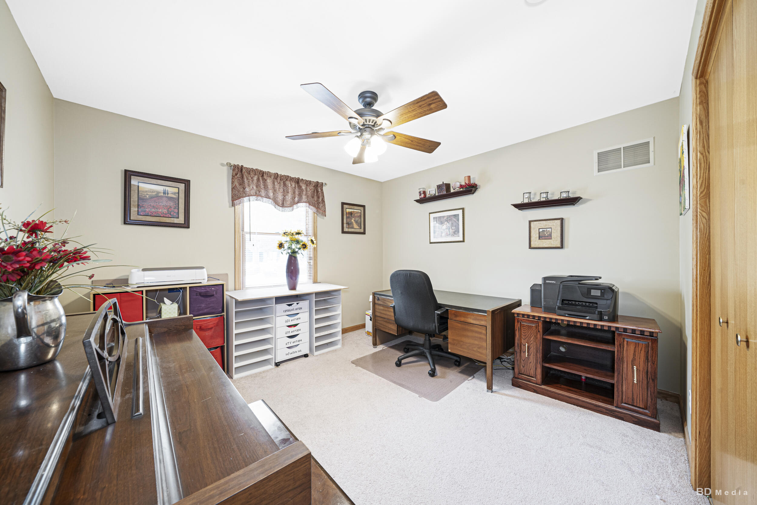 925 Cedar Drive Crown Point, IN 46307 - Photo 13 of 16 a view of a workspace with furniture and a window