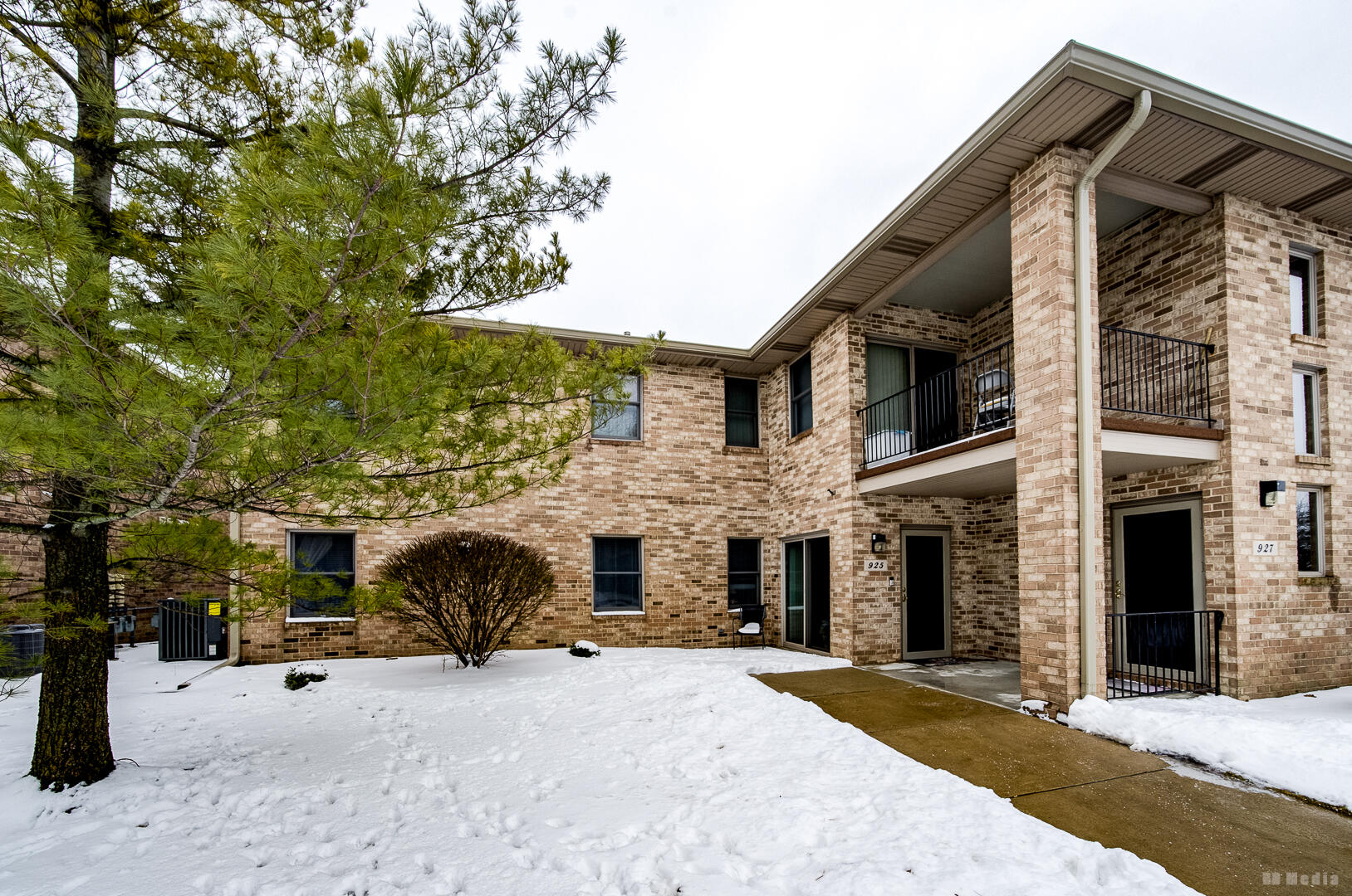 925 Cedar Drive Crown Point, IN 46307 - Photo 2 of 16 a front view of a house with a yard and garage