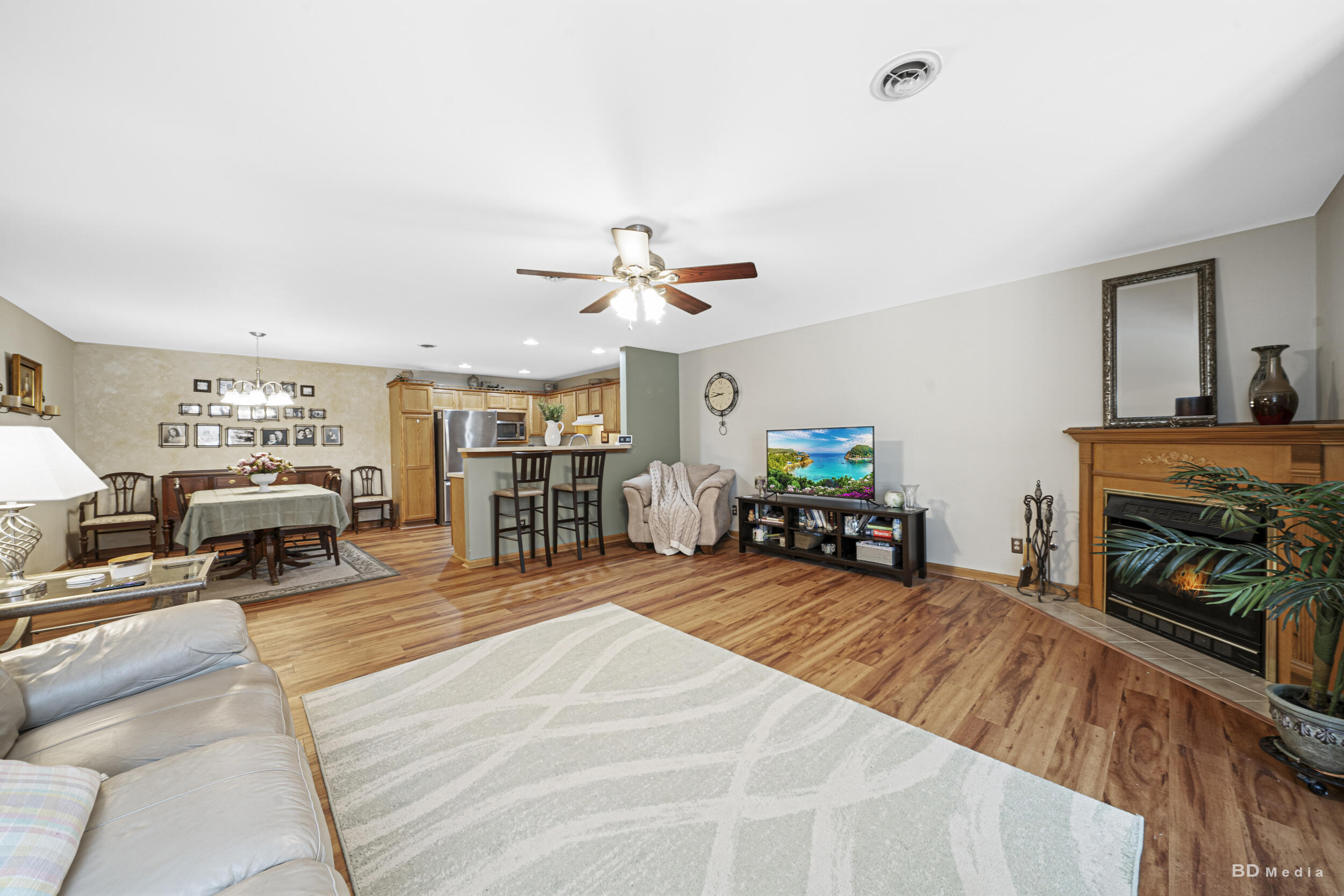 925 Cedar Drive Crown Point, IN 46307 - Photo 5 of 16 a large room with furniture a fireplace and a large window