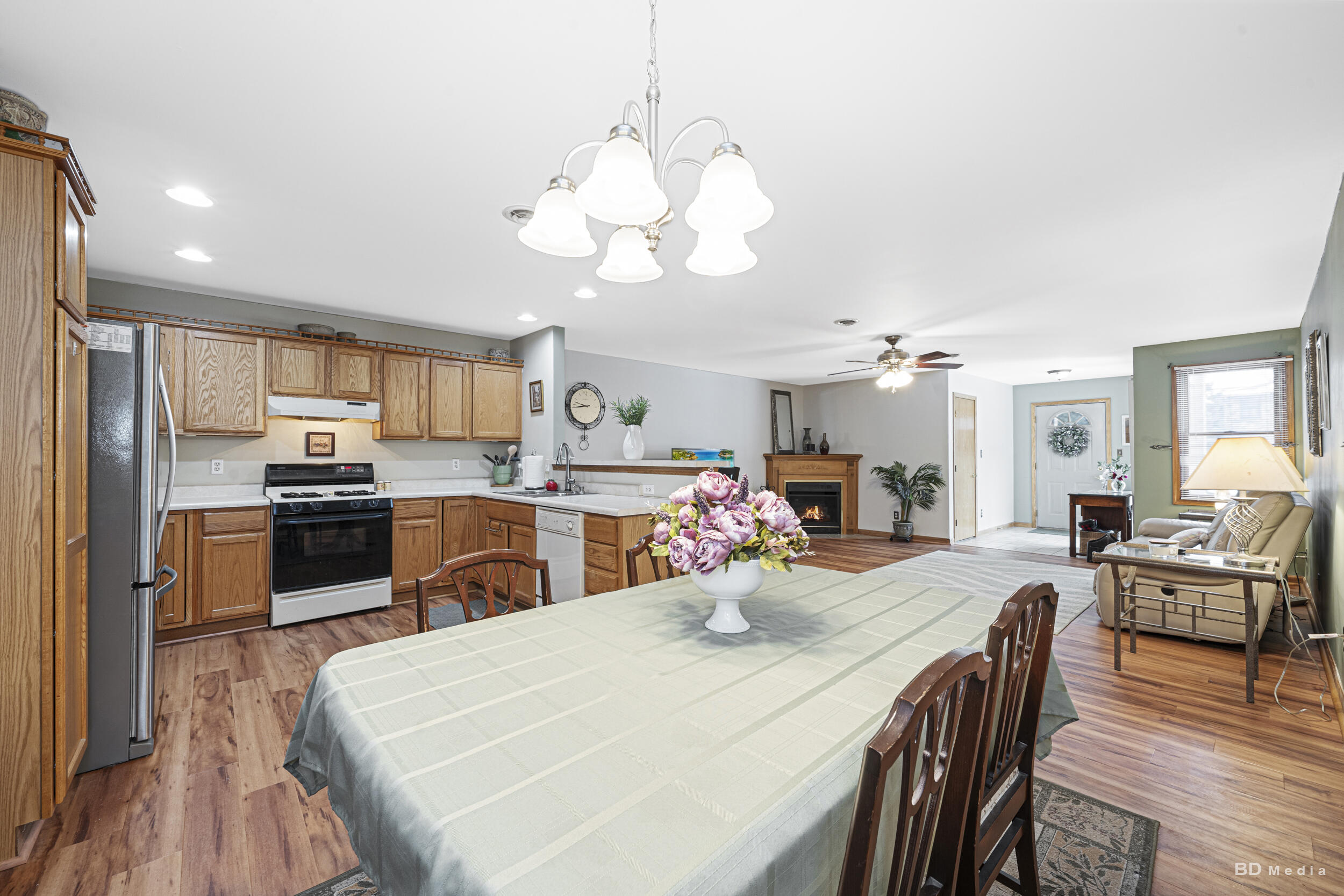 925 Cedar Drive Crown Point, IN 46307 - Photo 8 of 16 a kitchen with stainless steel appliances kitchen island granite countertop a sink dishwasher a stove a refrigerator with island and chairs