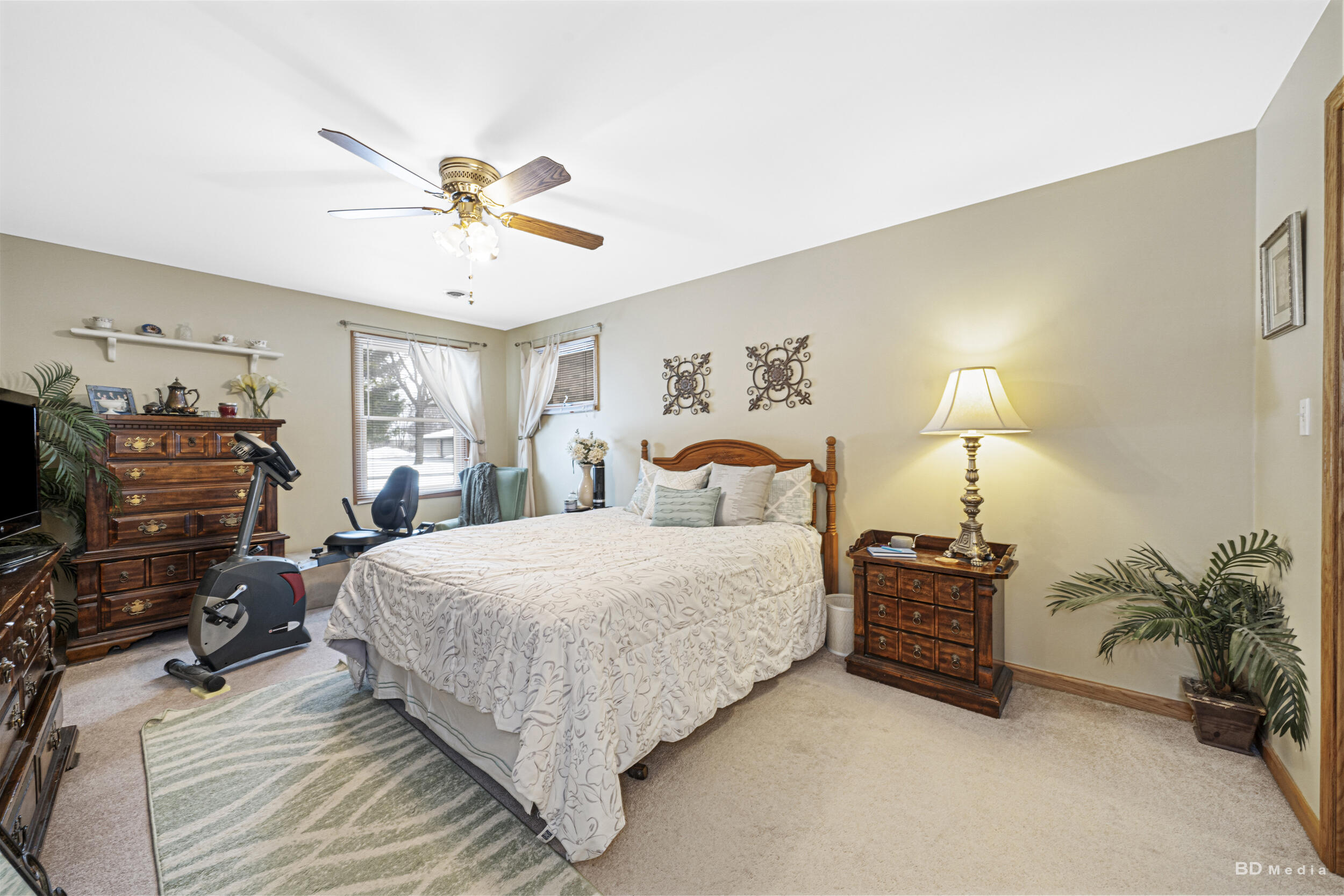 925 Cedar Drive Crown Point, IN 46307 - Photo 10 of 16 a bedroom with a bed and a chandelier