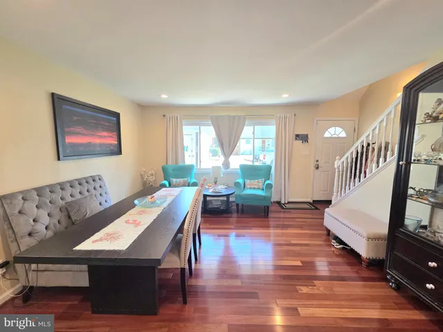 a view of a livingroom with furniture window and wooden floor
