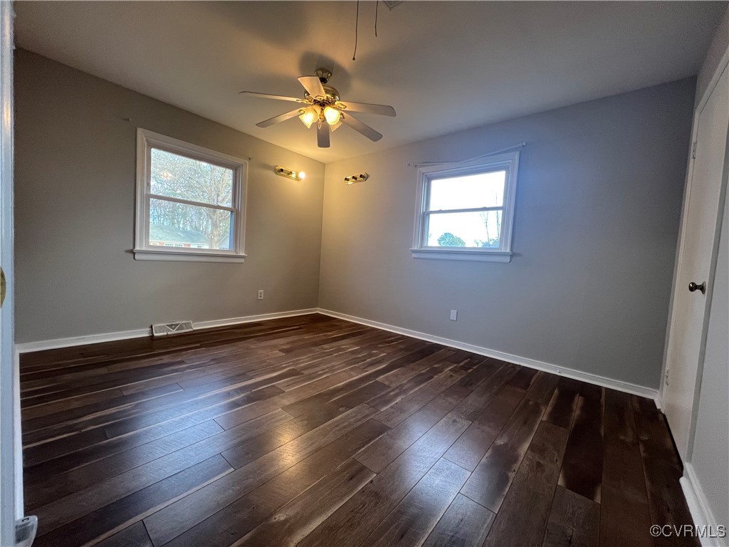 4101 Norborne Road Richmond, VA 23234 - Photo 8 of 10 Spare room with dark wood-style floors, baseboards