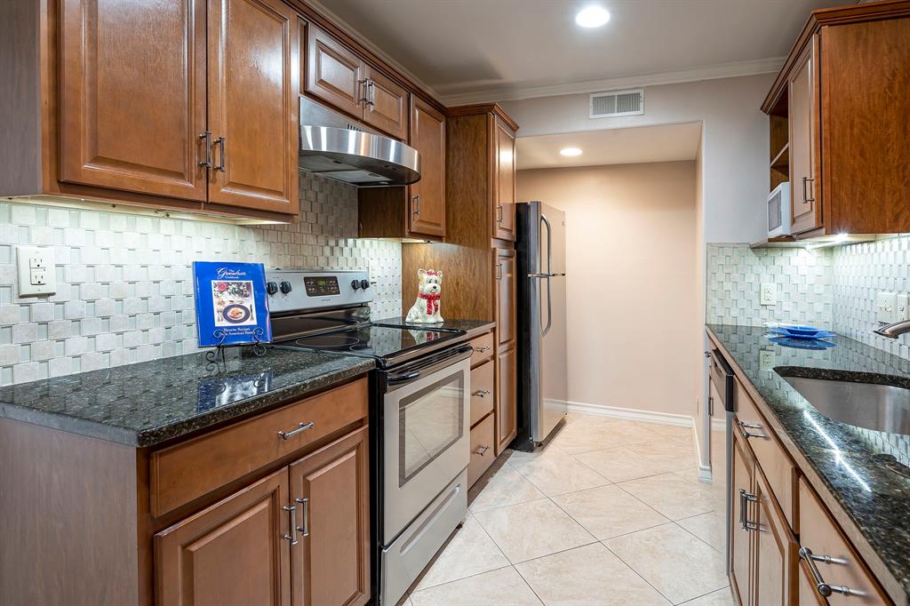 10757 Villager Road, Unit B Dallas, TX 75230 - Photo 1 of 36 Custom remodeled kitchen is open to living and dining area. featuring granite counters, recessed lighting, stainless appliances