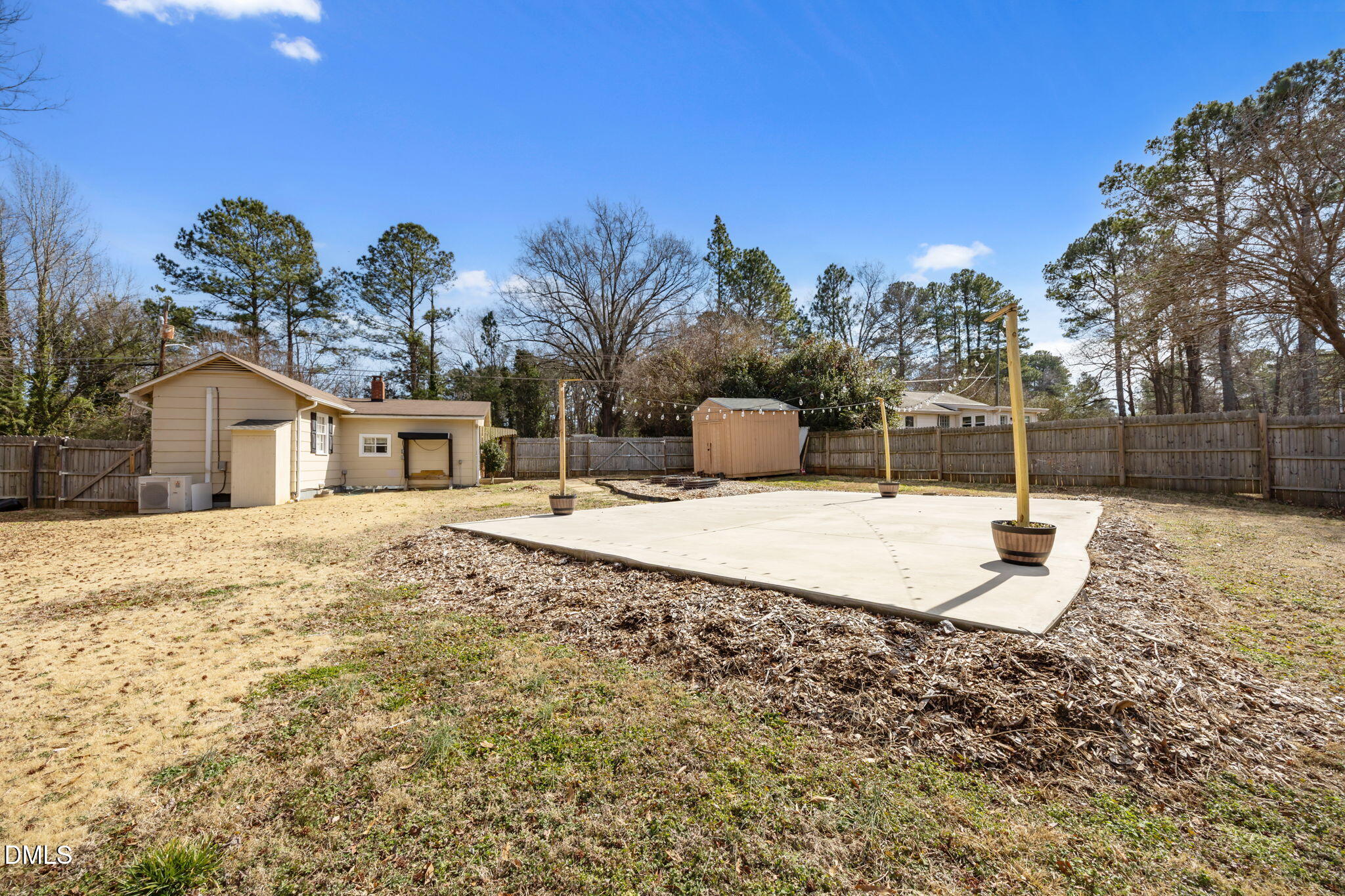 209 Weston Road Garner, NC 27529 - Photo 27 of 37 a backyard of a house with table and chairs