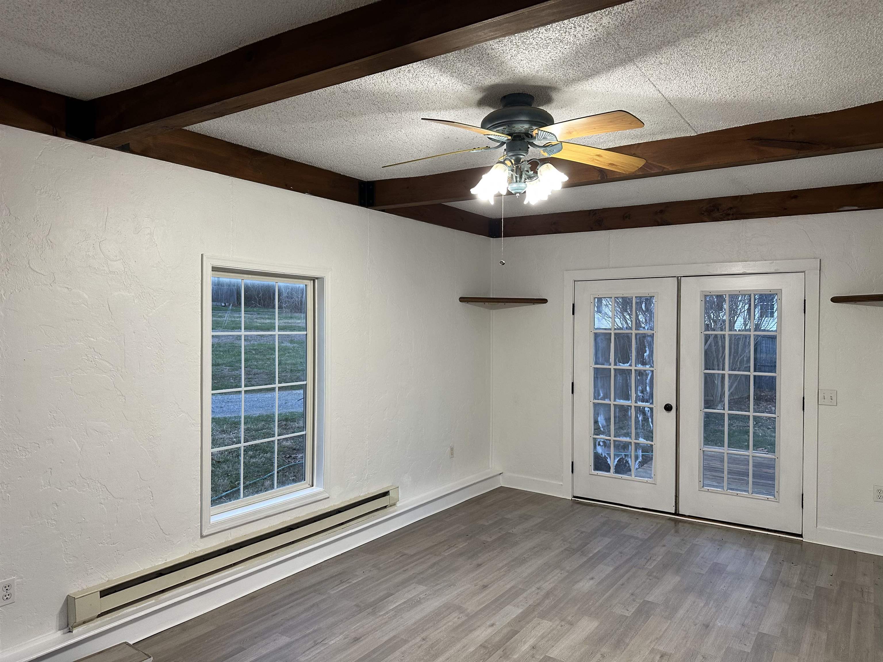 815 Beagle Gap Road Crozet, VA 22932 - Photo 11 of 18 a view of an empty room with a window and wooden floor