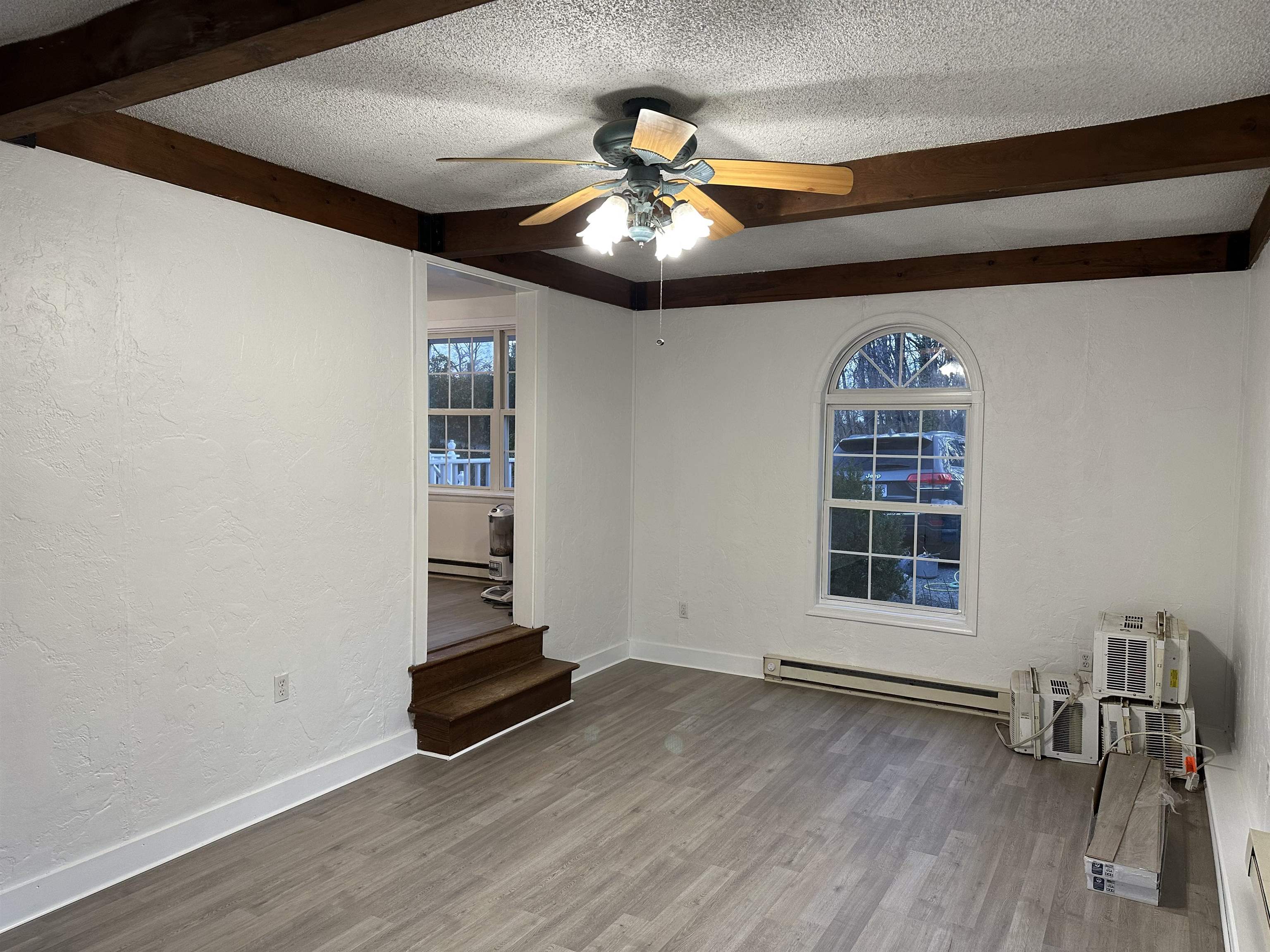815 Beagle Gap Road Crozet, VA 22932 - Photo 12 of 18 a view of an empty room with wooden floor and a window