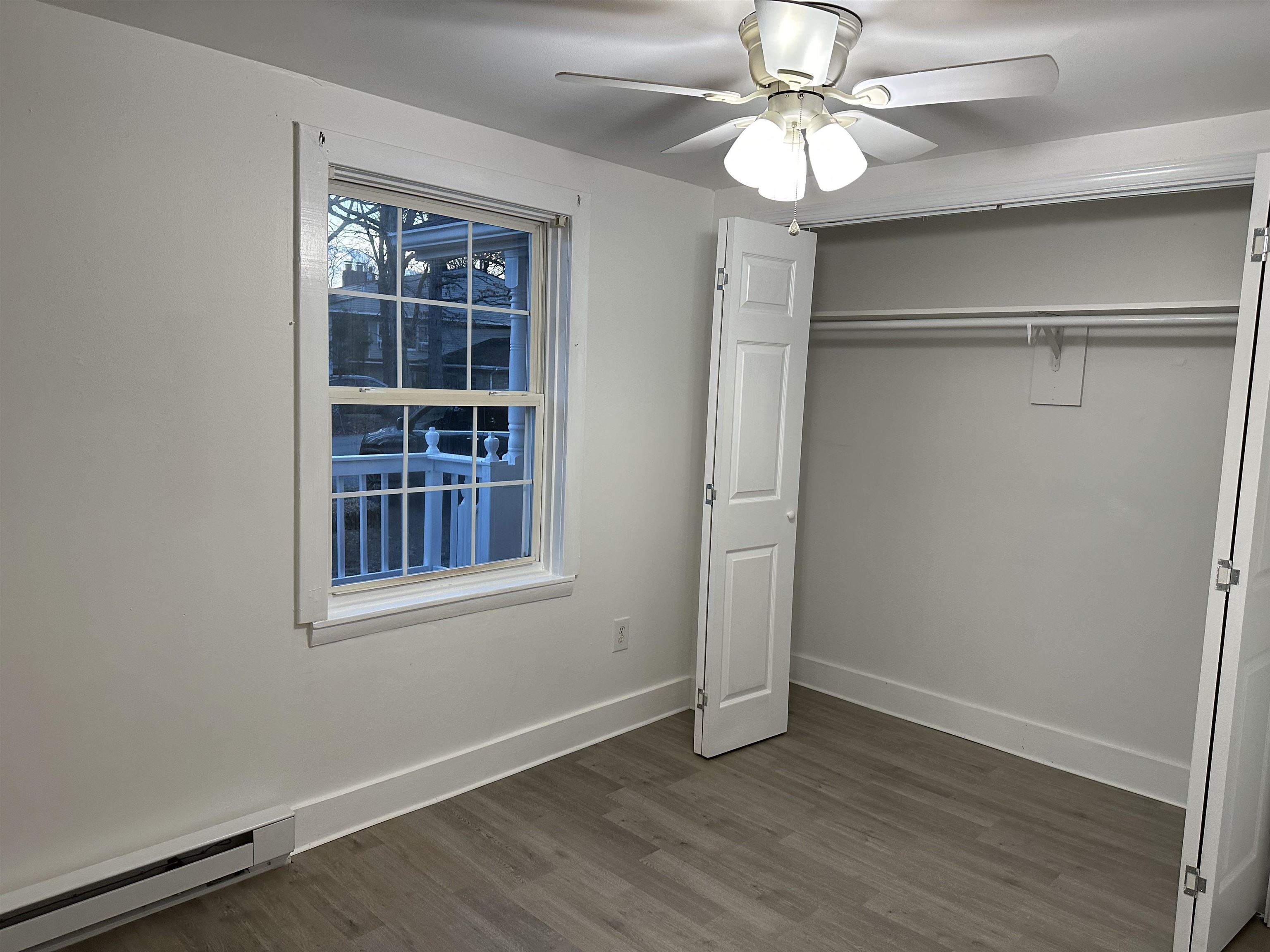 815 Beagle Gap Road Crozet, VA 22932 - Photo 16 of 18 a view of an empty room with a window and wooden floor