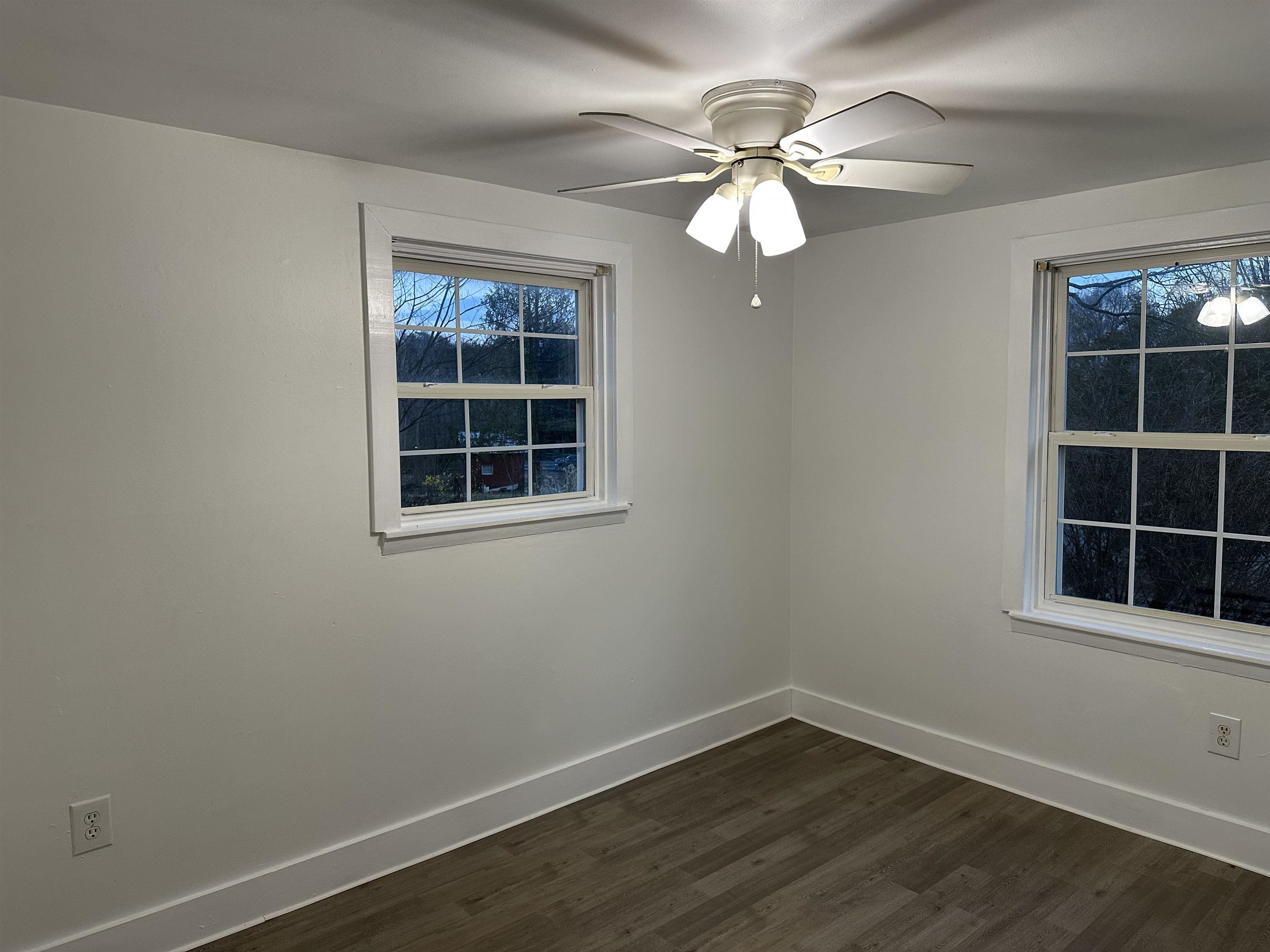 815 Beagle Gap Road Crozet, VA 22932 - Photo 17 of 18 a view of empty room with wooden floor and fan