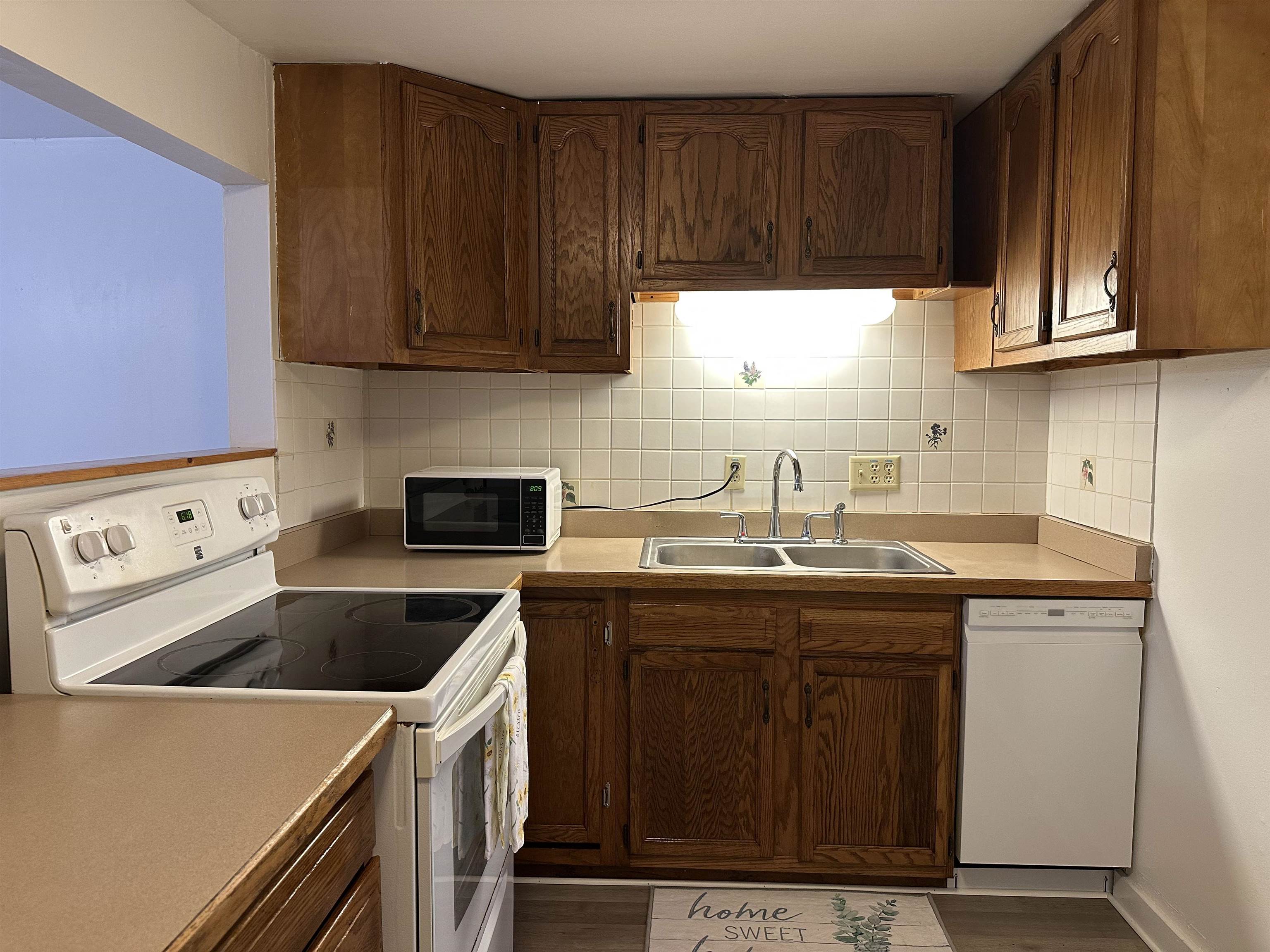 815 Beagle Gap Road Crozet, VA 22932 - Photo 9 of 18 a kitchen with a sink and cabinets