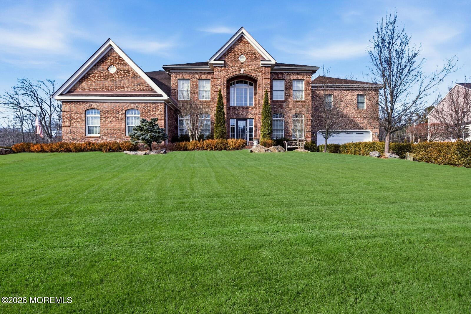 a front view of a house with a yard