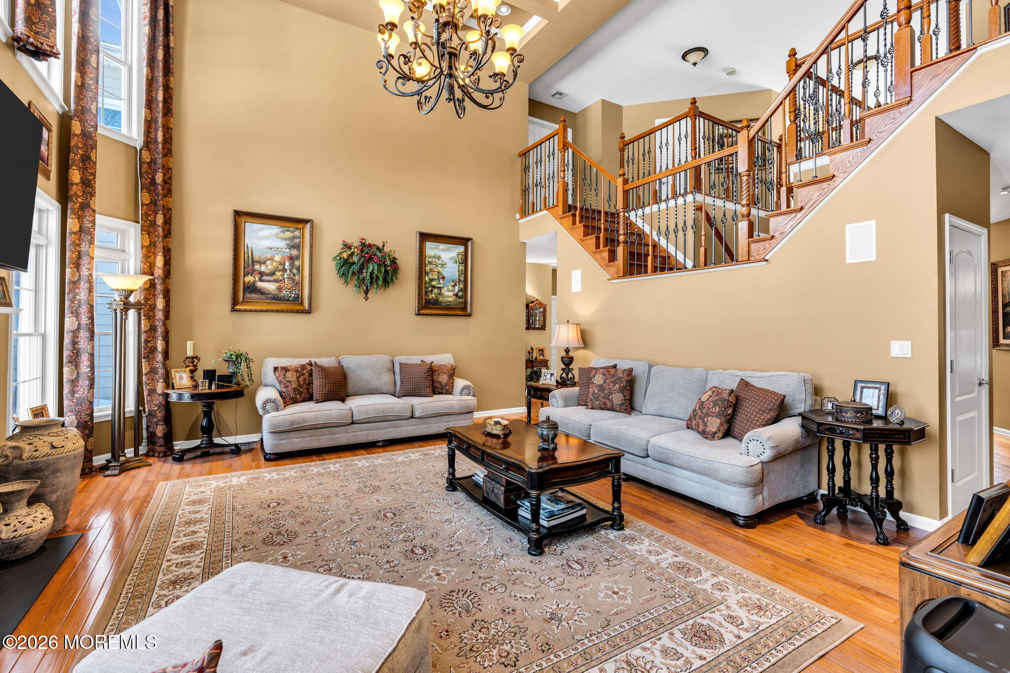 24 Parkside Drive Jackson, NJ 08527 - Photo 35 of 91 a living room with furniture a chandelier and a rug