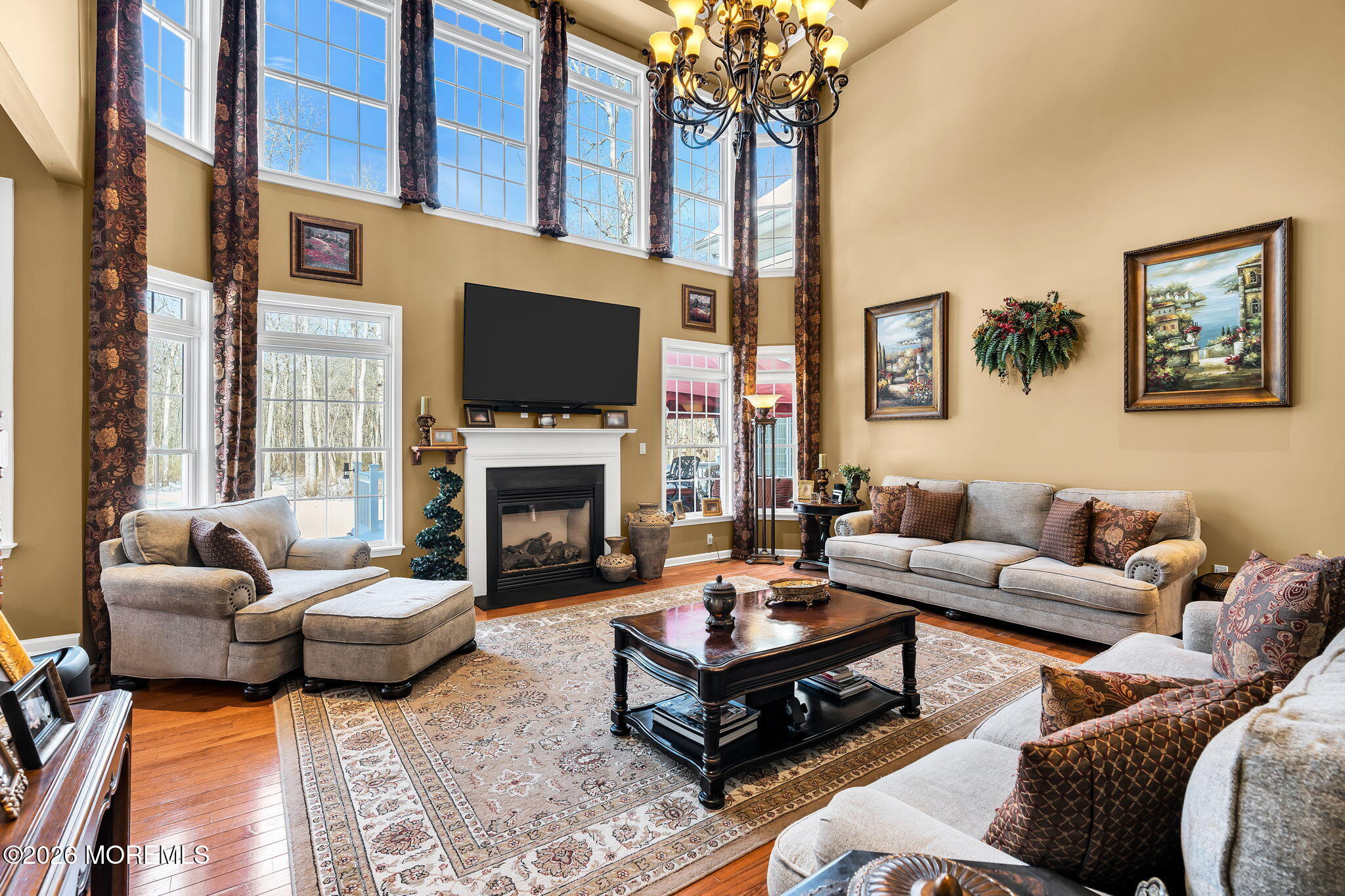 24 Parkside Drive Jackson, NJ 08527 - Photo 45 of 91 a living room with furniture a fireplace and a flat screen tv