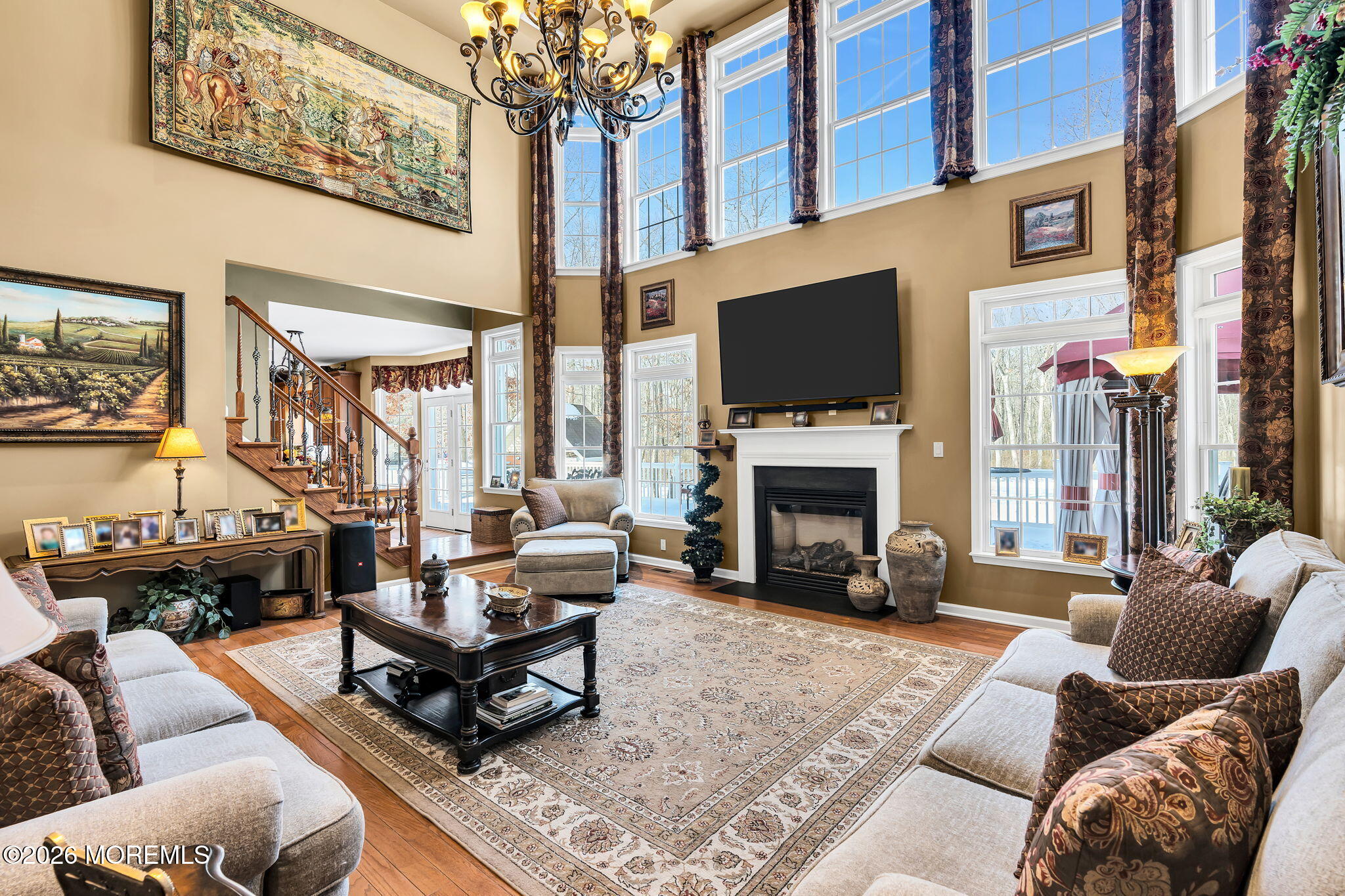 24 Parkside Drive Jackson, NJ 08527 - Photo 46 of 91 a living room with furniture a fireplace and a flat screen tv