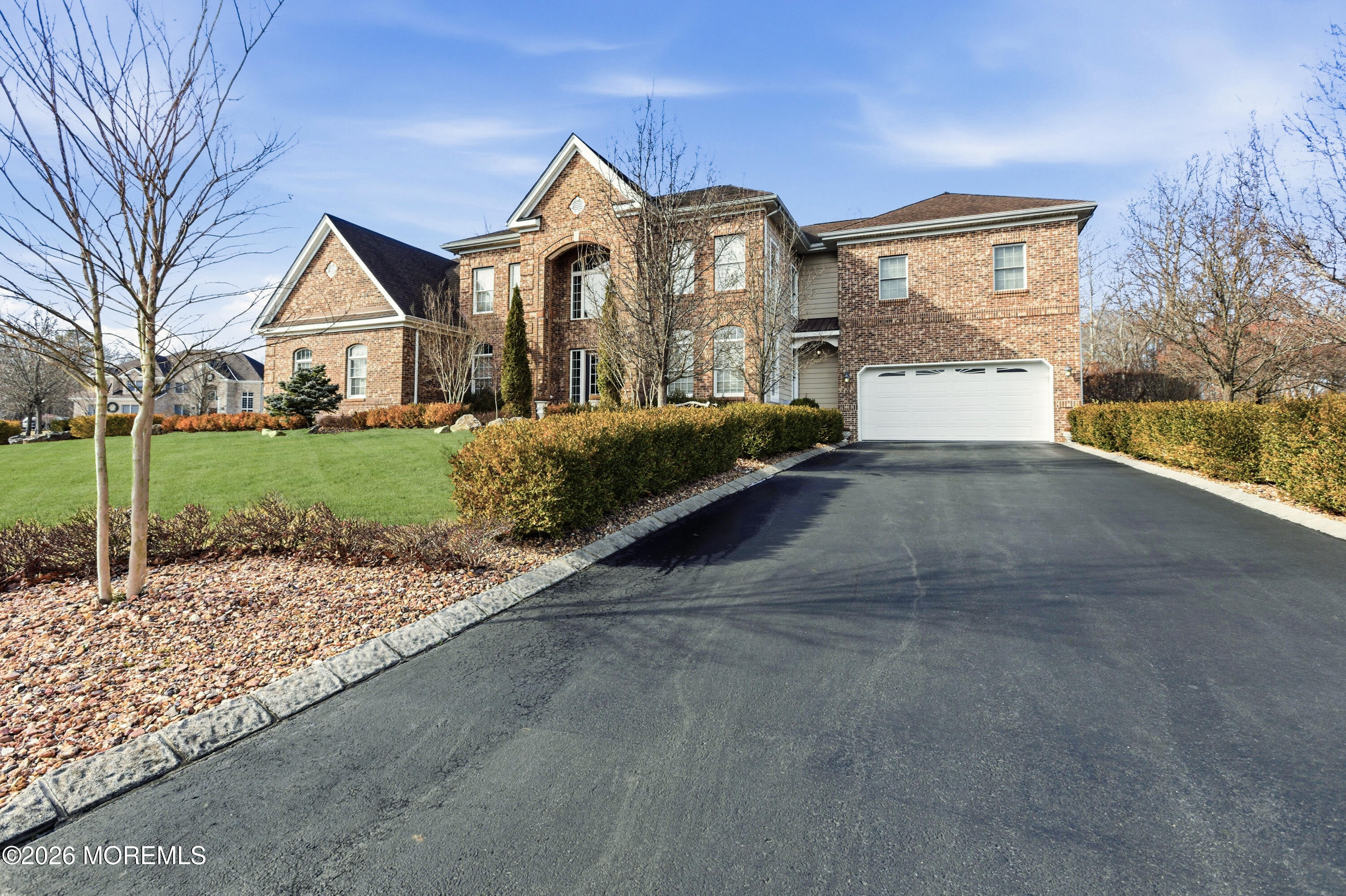 24 Parkside Drive Jackson, NJ 08527 - Photo 5 of 91 a front view of a house with a yard and garage