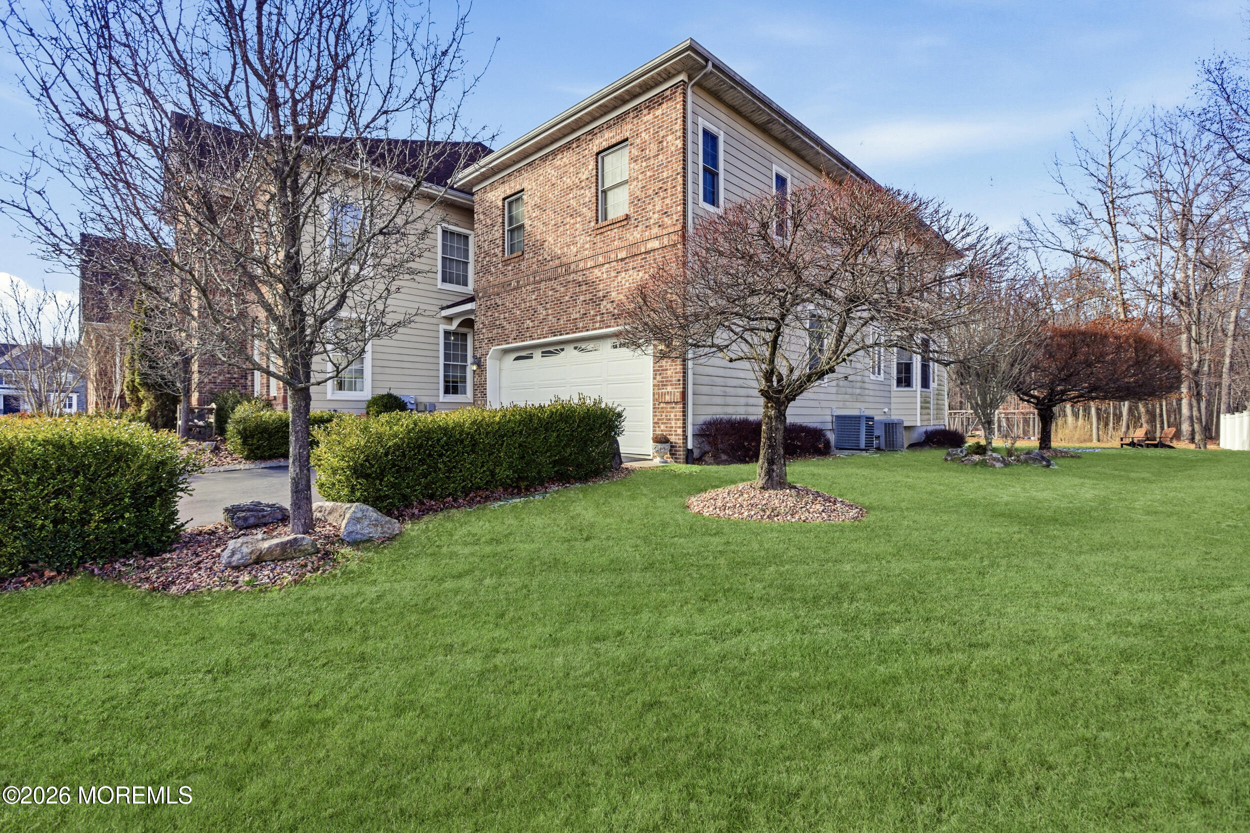 24 Parkside Drive Jackson, NJ 08527 - Photo 7 of 91 a front view of a house with garden and trees