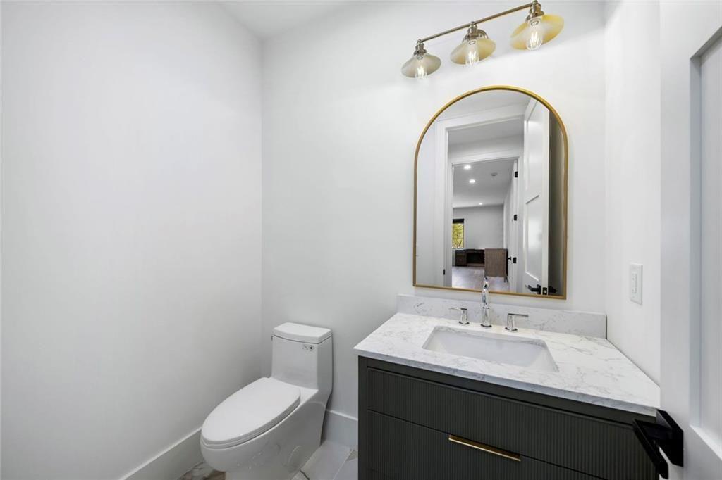 2309 Dinsmore Road Milton, GA 30004 - Photo 45 of 87 a bathroom with a sink and a toilet