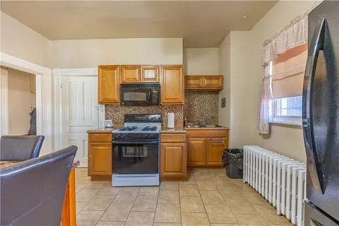a kitchen with stainless steel appliances granite countertop a stove and a sink