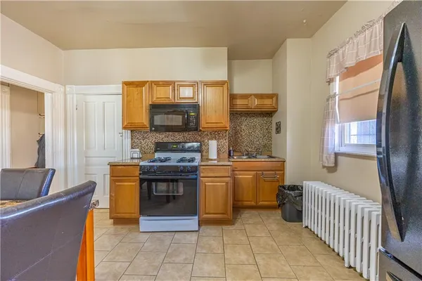 a kitchen with stainless steel appliances granite countertop a stove and a sink