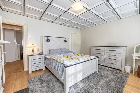 a bedroom with a bed and cabinets