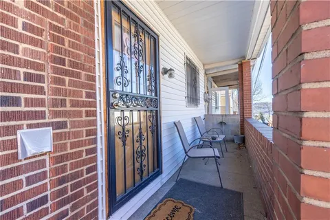 a view of a brick wall and dining room