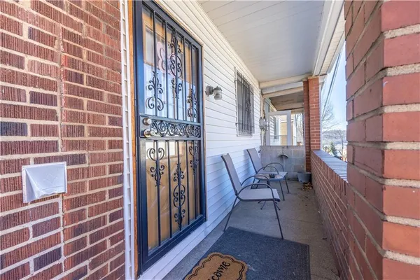 a view of a brick wall and dining room
