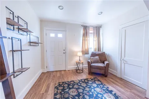 a living room with furniture and a rug