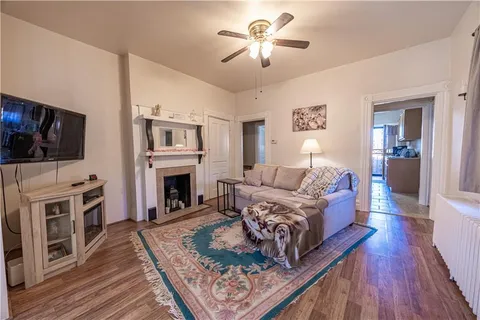 a living room with furniture fireplace and flat screen tv