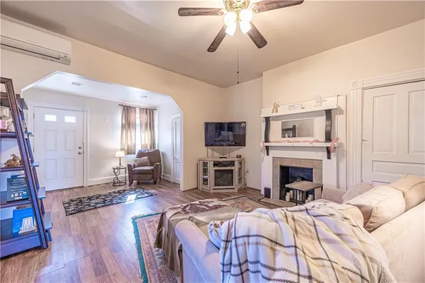 a spacious bedroom with a large bed and a fireplace
