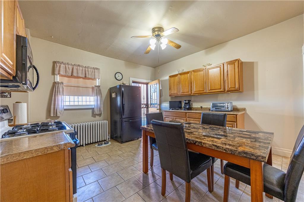 3245 Juliet Street Pittsburgh, PA 15213 - Photo 10 of 22 a view of a dining room with furniture and chandelier