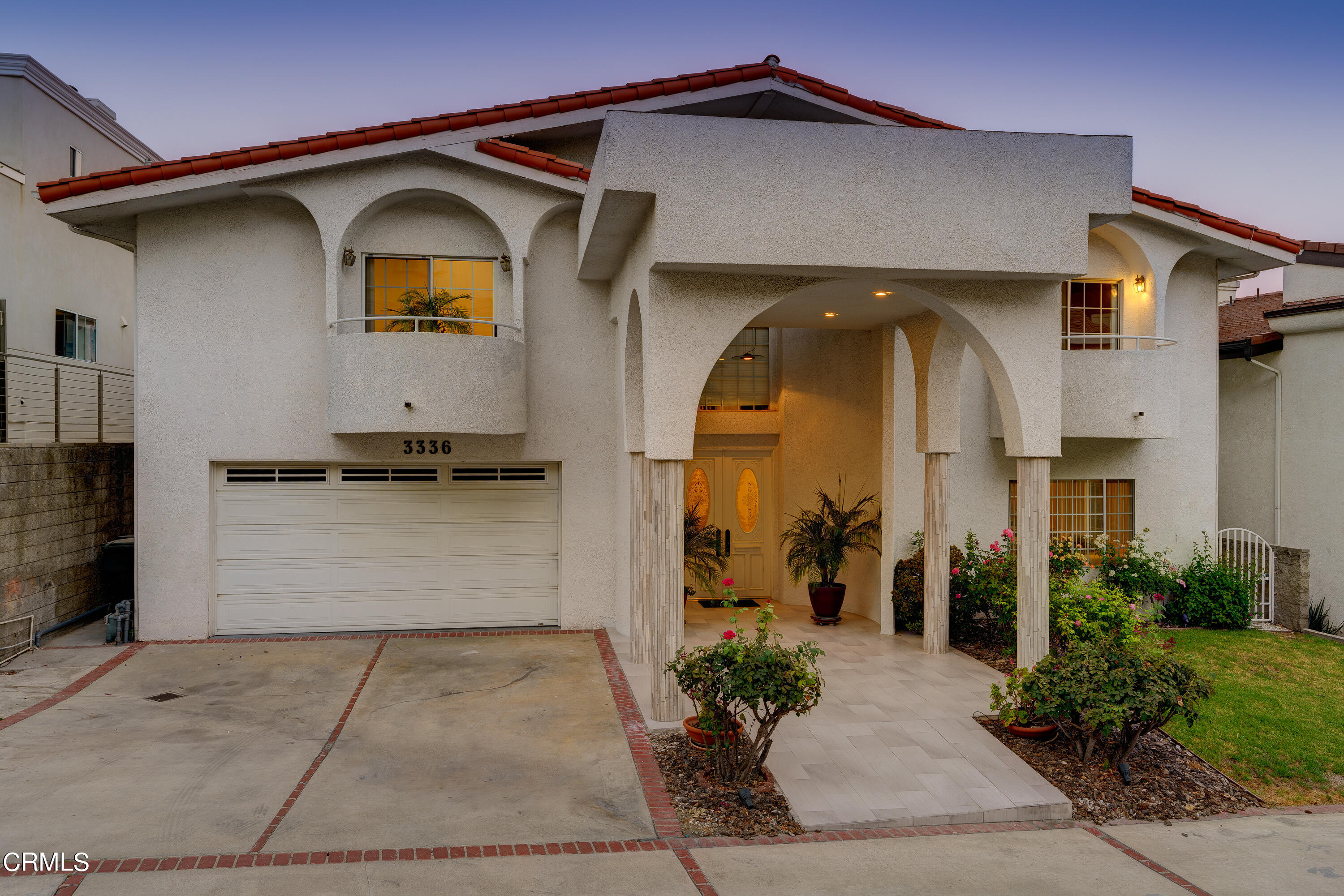 a front view of a house with a yard