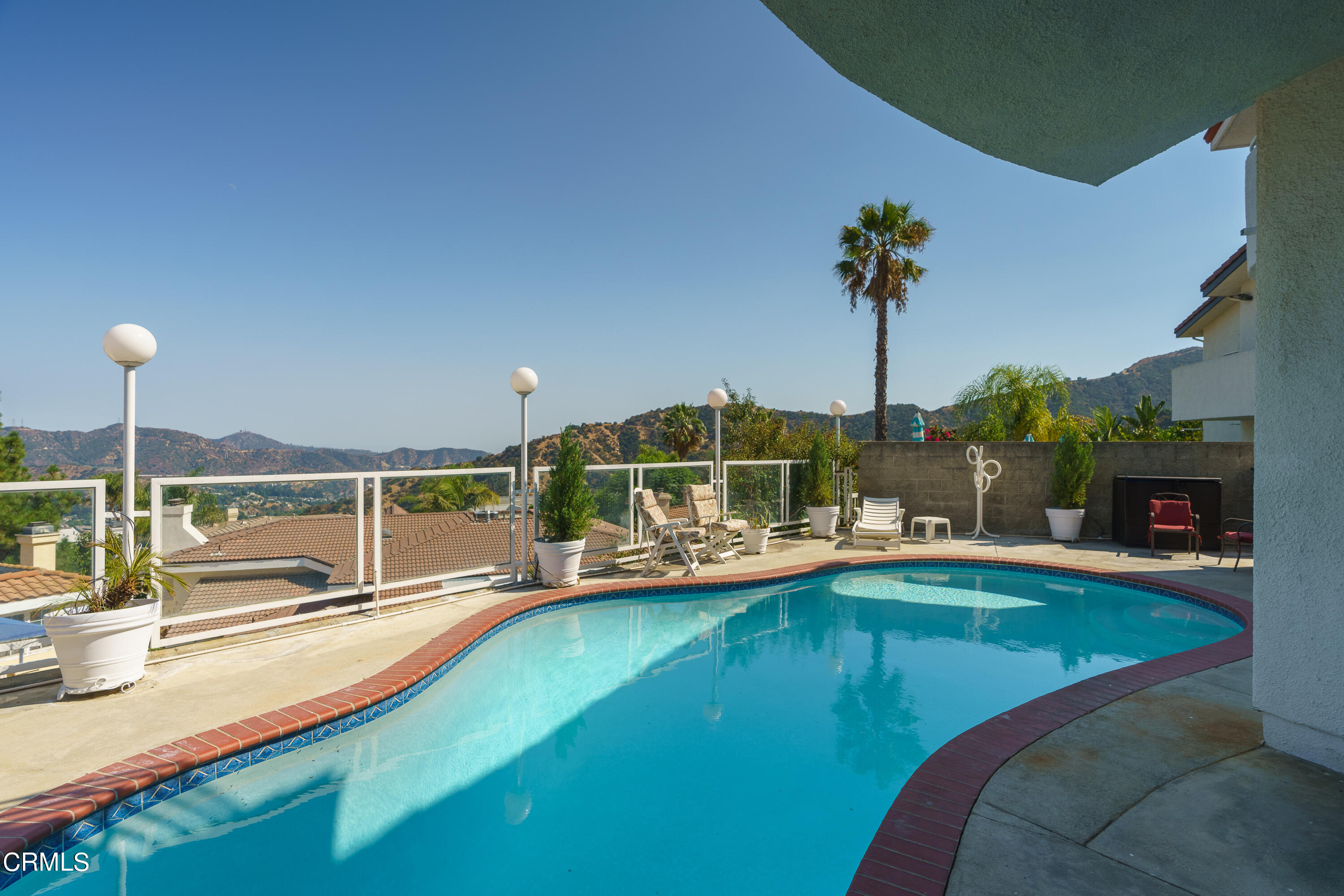 3336 Stephens Circle Glendale, CA 91208 - Photo 31 of 74 a view of a swimming pool with a lounge chairs