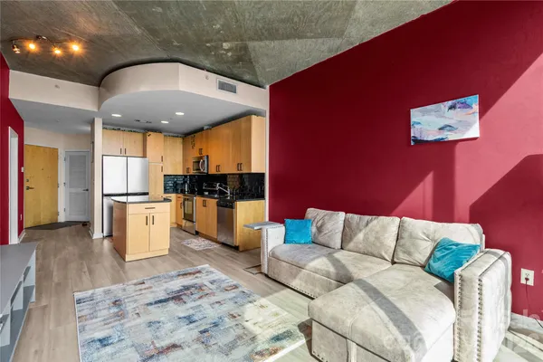 a bedroom with furniture and a flat screen tv