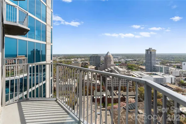 a view of a balcony with city view
