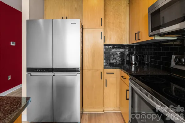 a kitchen with a stove and a microwave