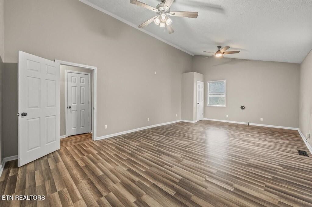 518 Flatt Spur Road Jamestown, TN 38556 - Photo 14 of 30 a view of an empty room with wooden floor